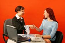 Job Applicant Shaking Hands with Career Counselor