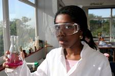 Girl Student Performing Experiment in Laboratory