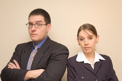 Man and Woman Staring with Frowning Face Expressions