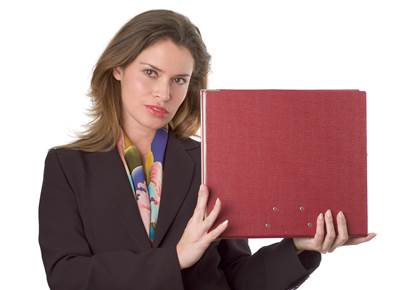 Well Dressed Lady Holding Up a Folder of Papers