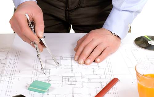An Architect Working on a Blueprint