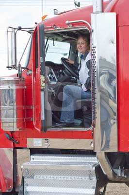 A Female Truck Driver in Her Truck