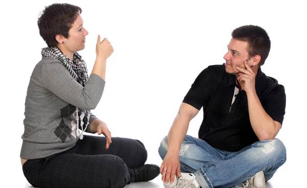 A Sign Language Interpreter Training a Student