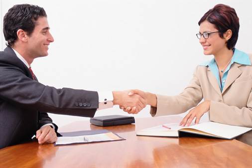 An Interviewer Shakes Hand with a Job Applicant