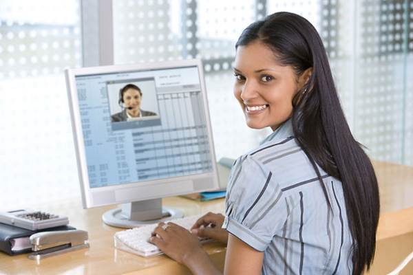 Girl Starting a Video Conference Interview on her Computer at Home