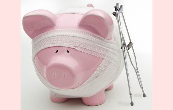 An 'Injured' and Bandaged Piggy Bank with Crutches