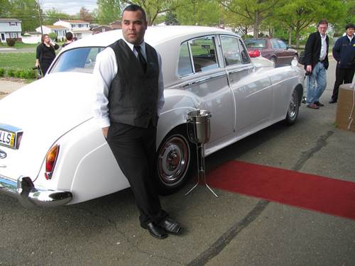 A Smartly Dressed Chauffeur for a 1964 Rolls Royce