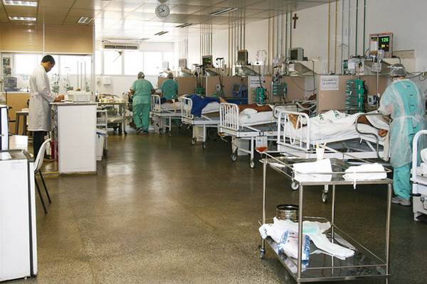 Medical Professionals Attending Patients in a Hospital Ward