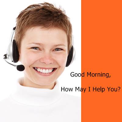 A Smiling Call Centre Representative Saying "Good Morning" on the Phone