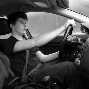 Young Man Driving a Car